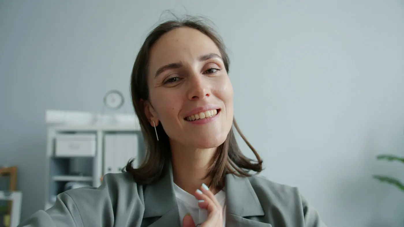 Staffing specialist smiling on a video call