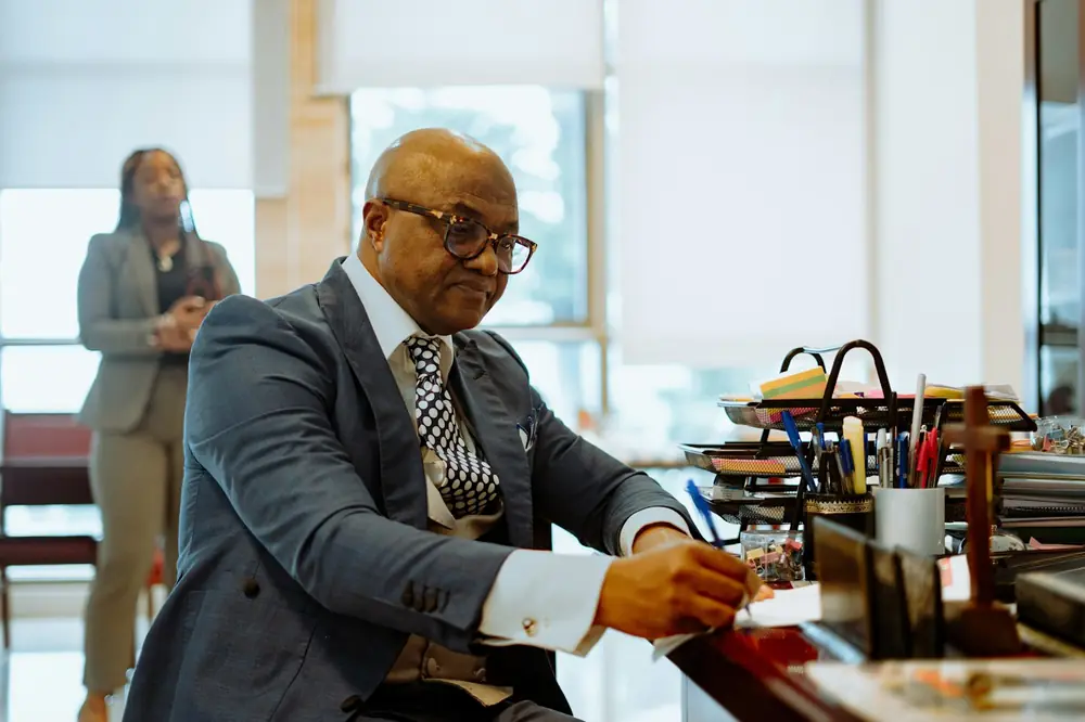 Ind Legal Attorney reviewing paperwork at his desk