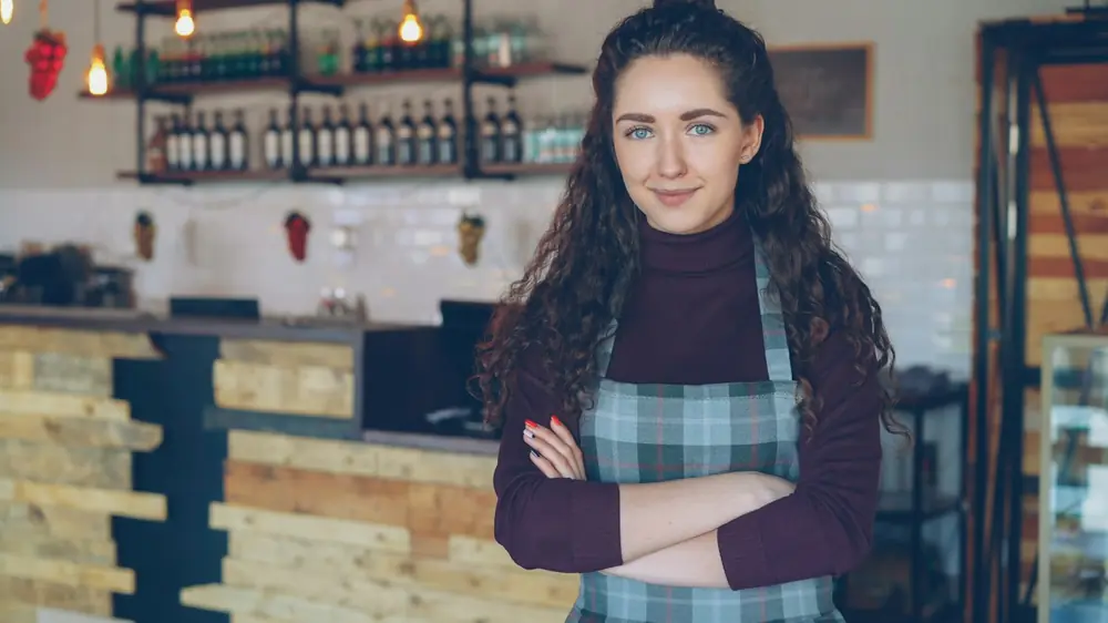 Owner Small business owner standing in her coffee shop